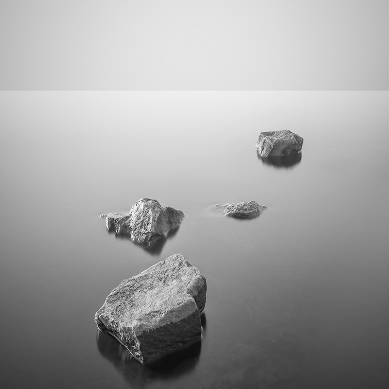 rocks in a still lake